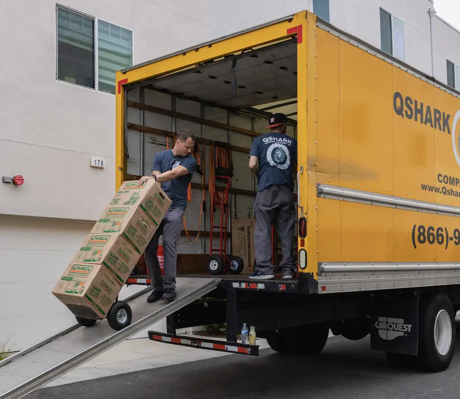 qshark employees loading a moving truck