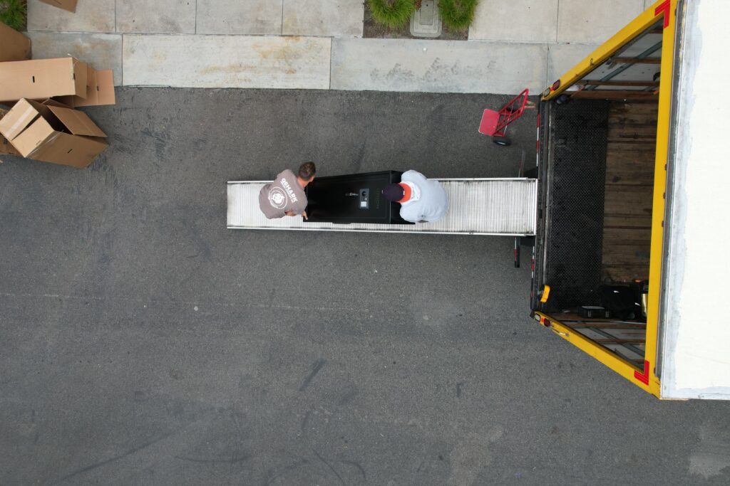 a picture of san diego movers unloading a safe
