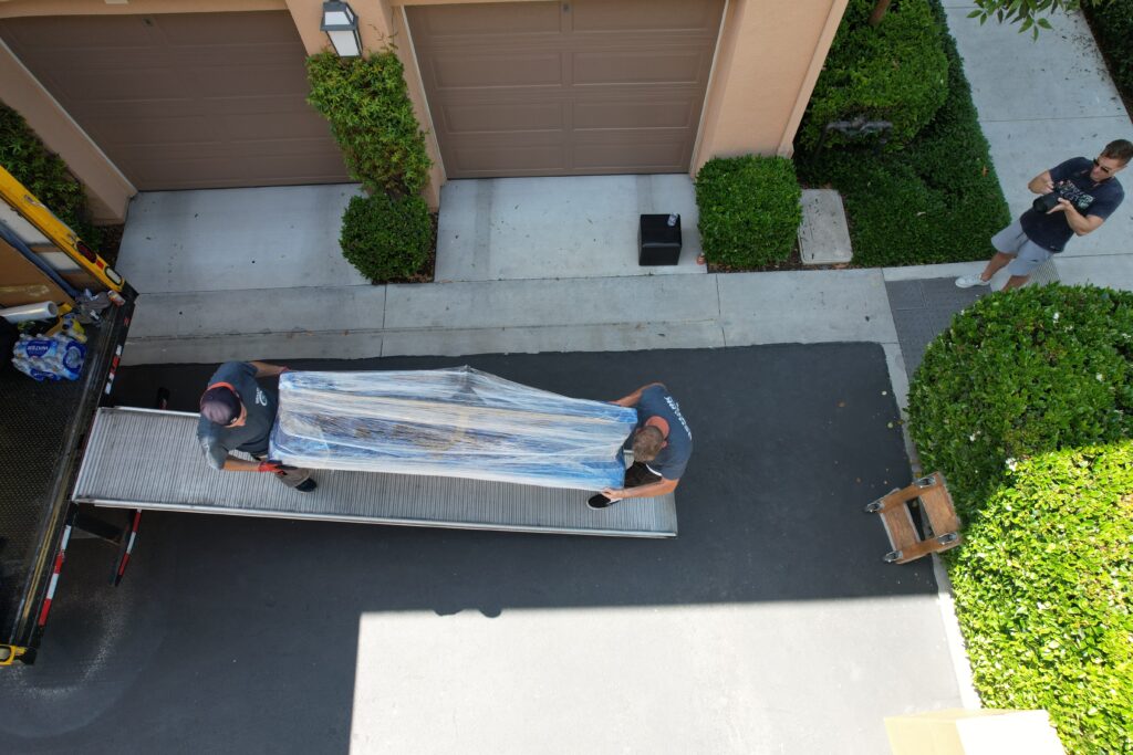 qshark office movers loading items into the truck