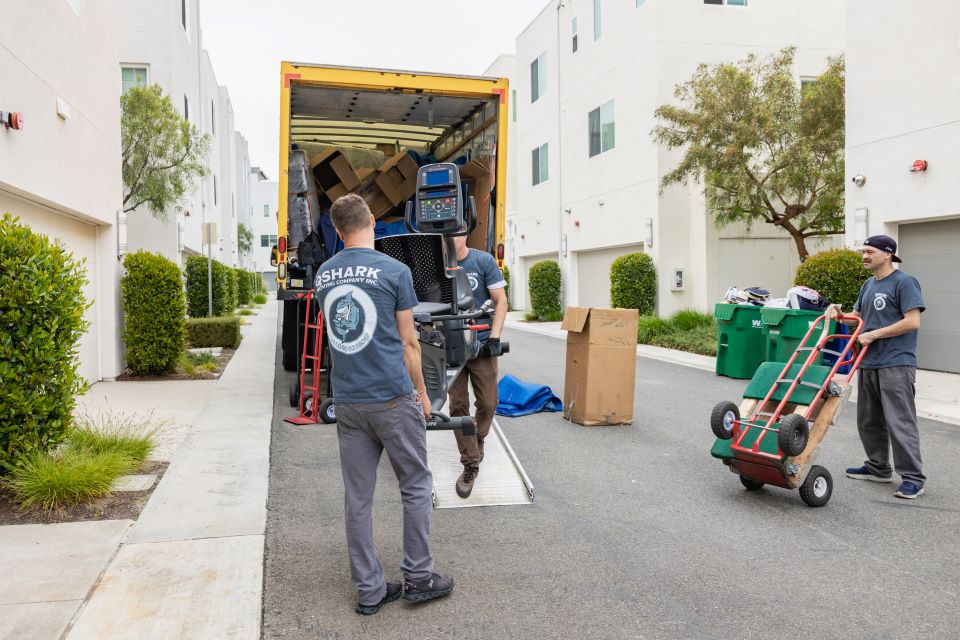 qshark movers unloading a moving truck