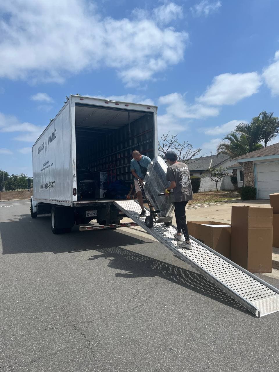 Heavy item loading by Qshark movers in Miami