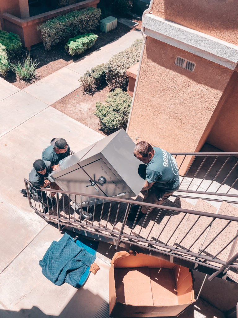 Qshark Movers in San Diego are moving a 400lbs safe up the stairs. Safe is a oversized item we can move for you