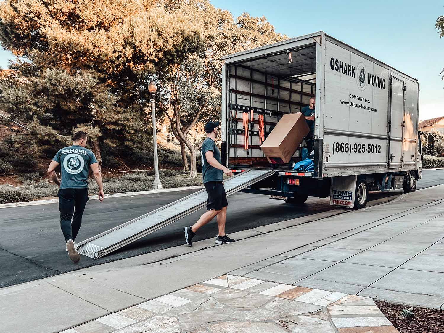 Professional moving team in action, moving furniture and boxes safely and efficiently. Trusted moving company in the area with experienced movers and top-notch equipment.