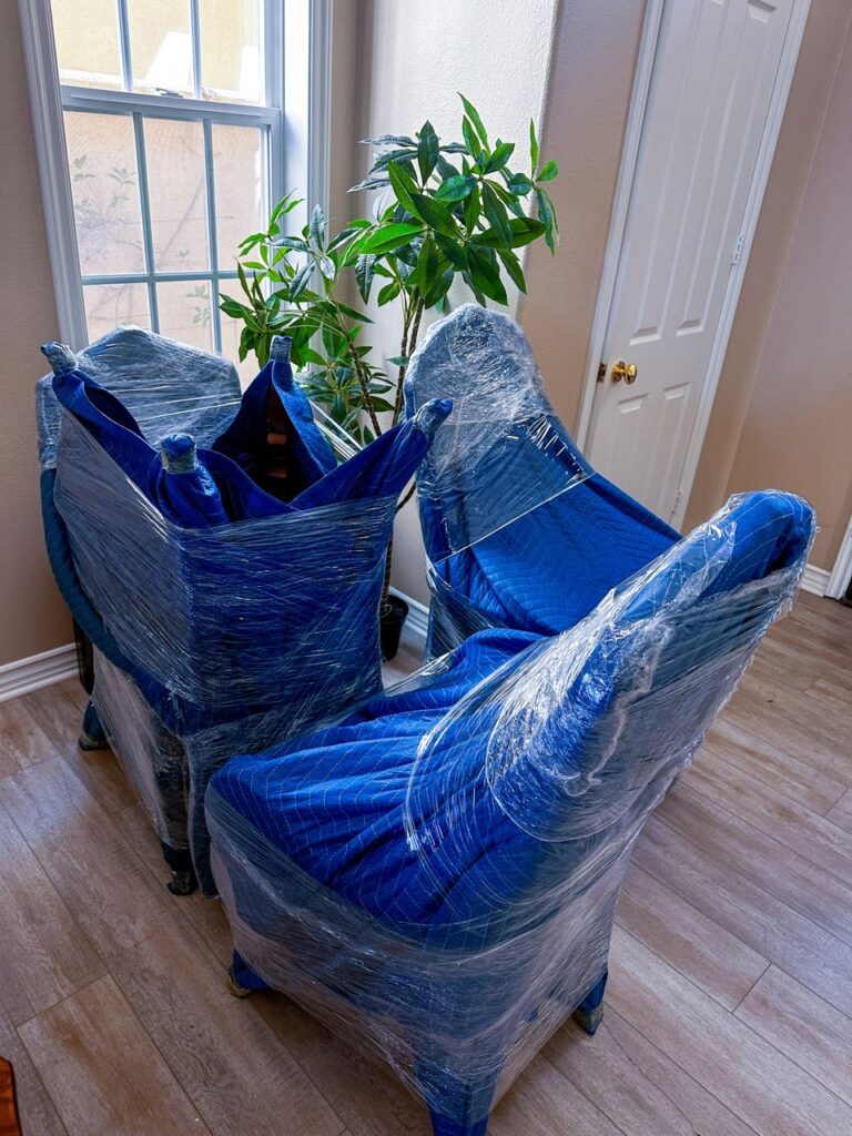 a picture showing packed chairs for moving service in san diego