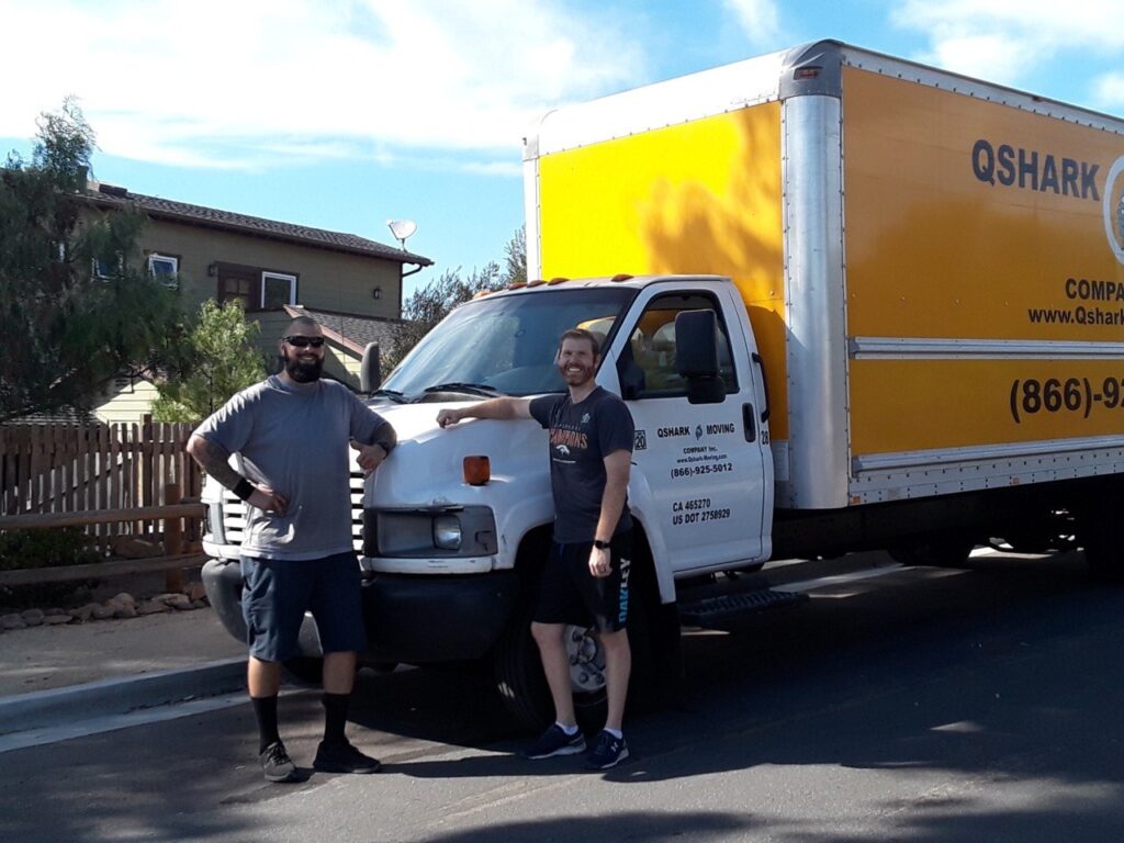 Professional movers efficiently loading a moving truck.