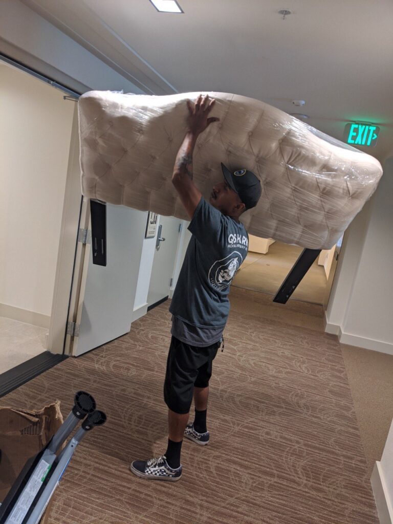 Mover moving a headboard