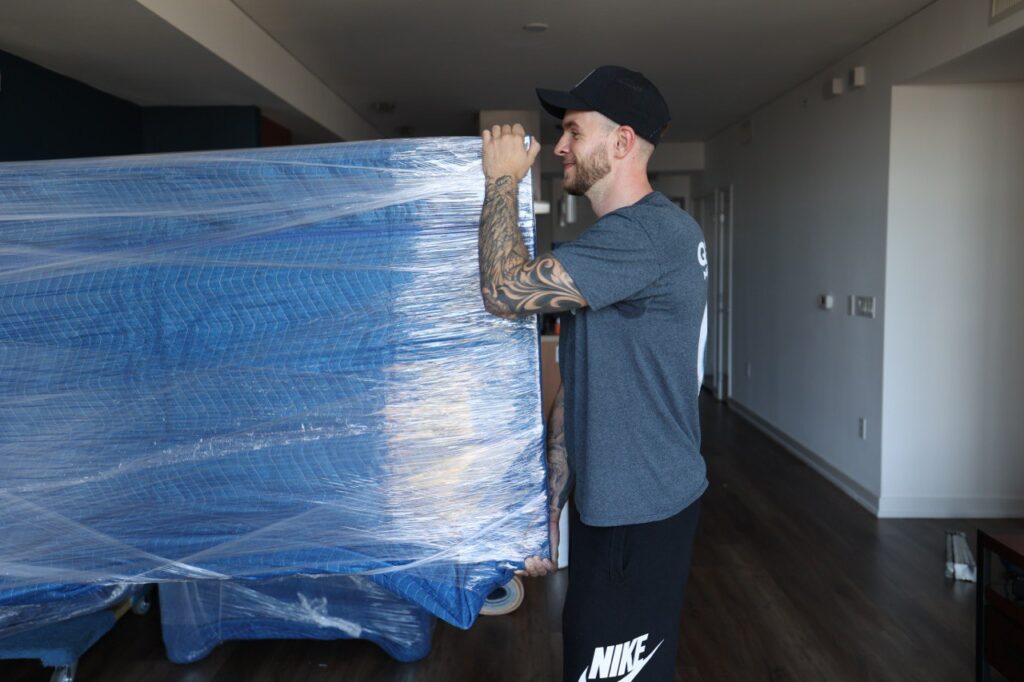 a picture of a mover moving a tv
