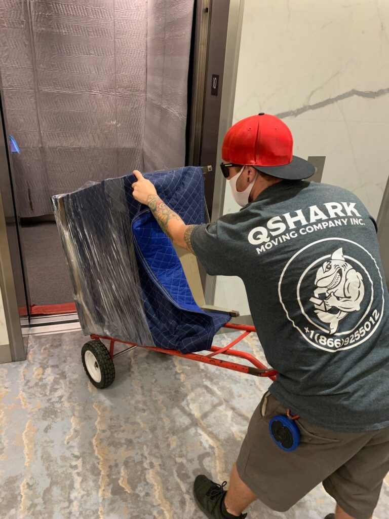 a picture of qshark mover moving a dresser