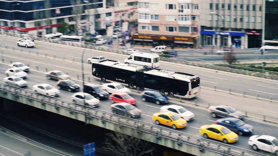a picture of moving cars and buses 