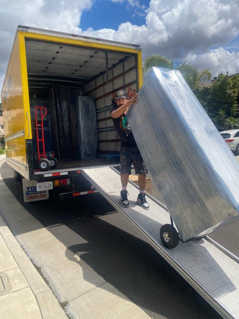 a picture of movers unloading a moving truck