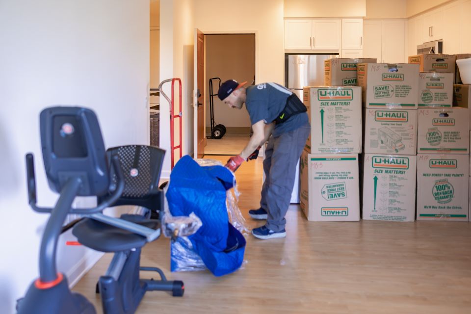 a picture of qshark mover unwrapping furniture