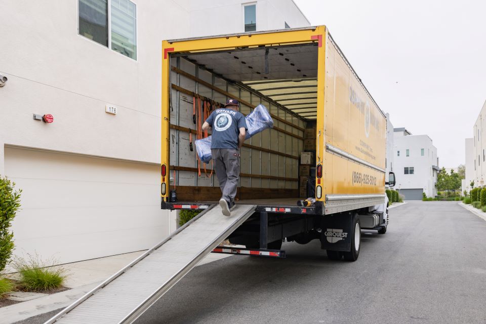 a pciture of a mover loading a truck
