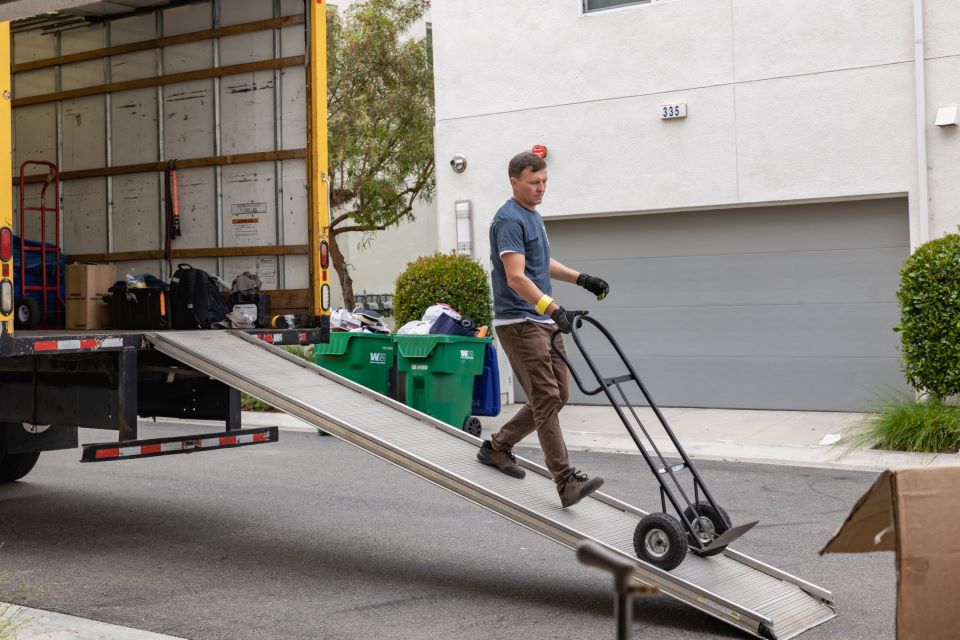 a picture of qshark movers unloading a moving truck