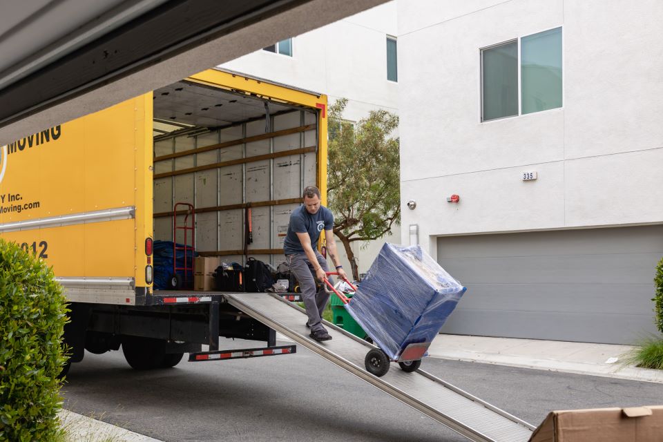 a picture of qshark movers unloading a truck