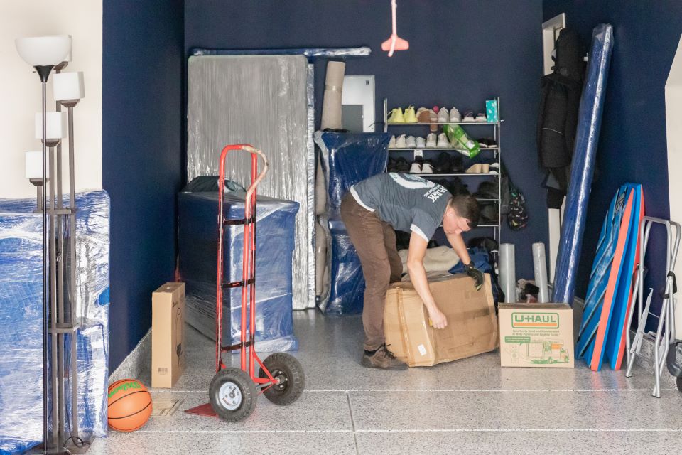 qshark movers unloading a garage. how much movers cost in los angeles