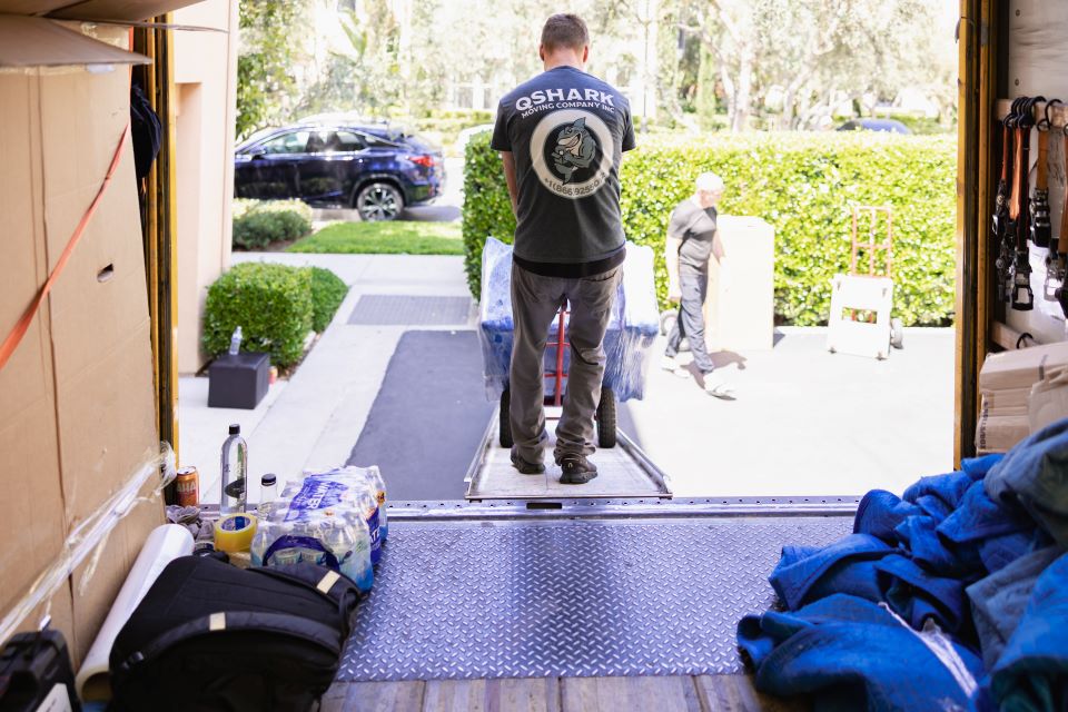 a picture of los angeles movers unloading a truck