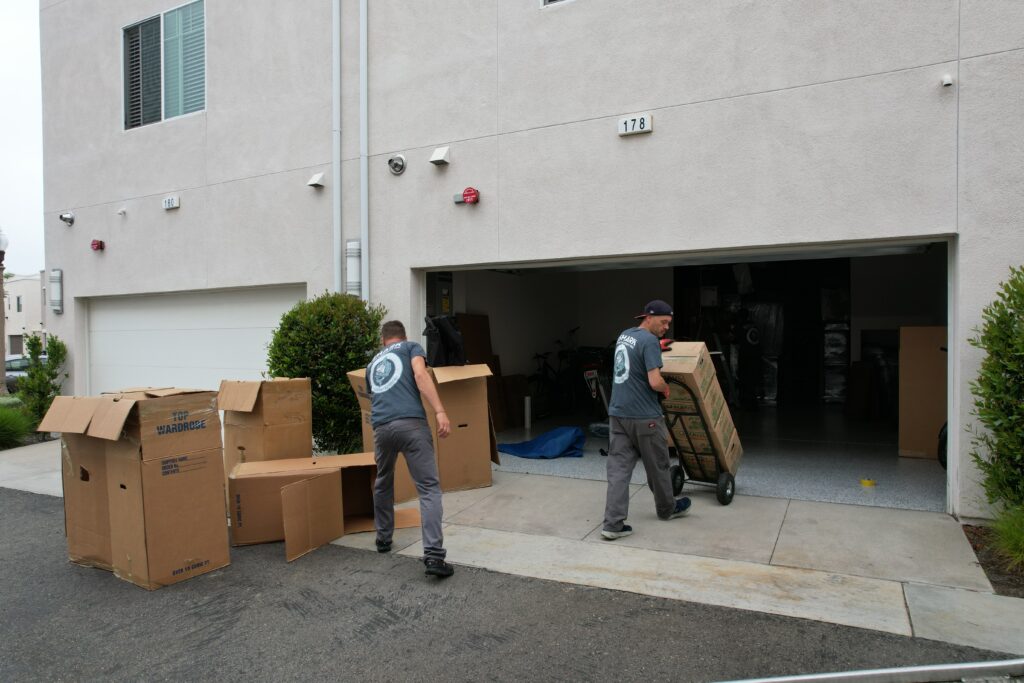 a picture of qshark movers unloading items into a garage