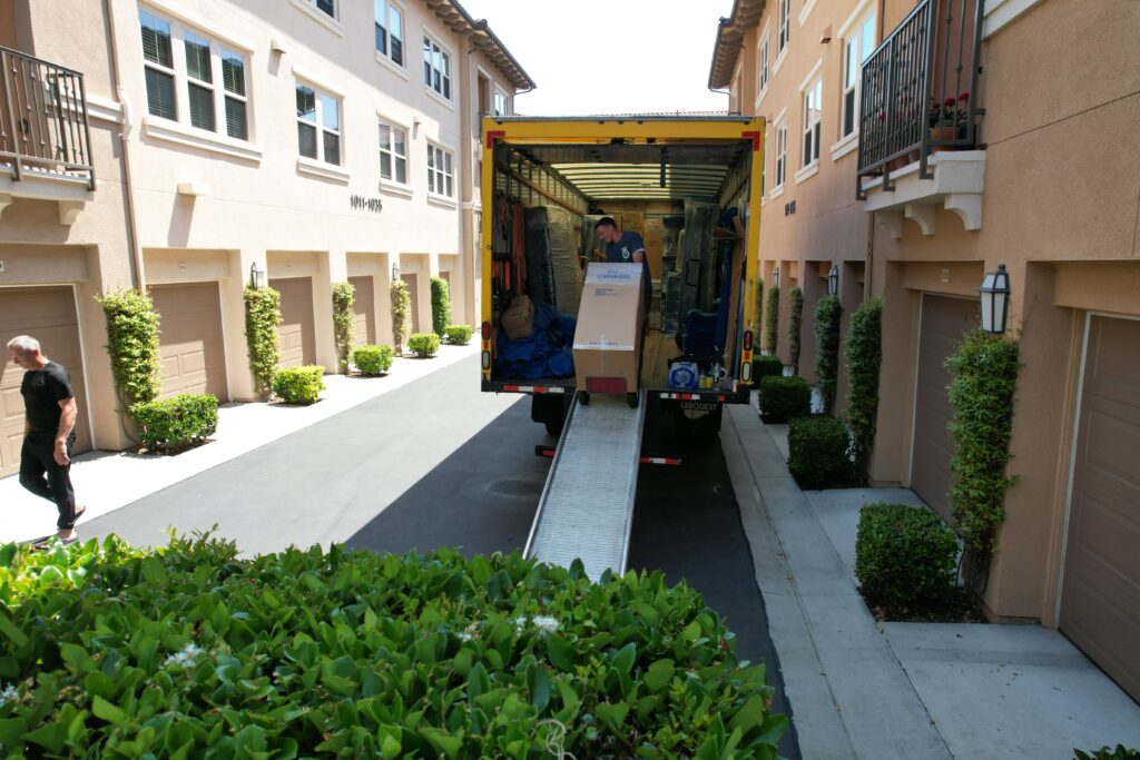 a picture of qshark movers loading a truck after packing dishes for moving