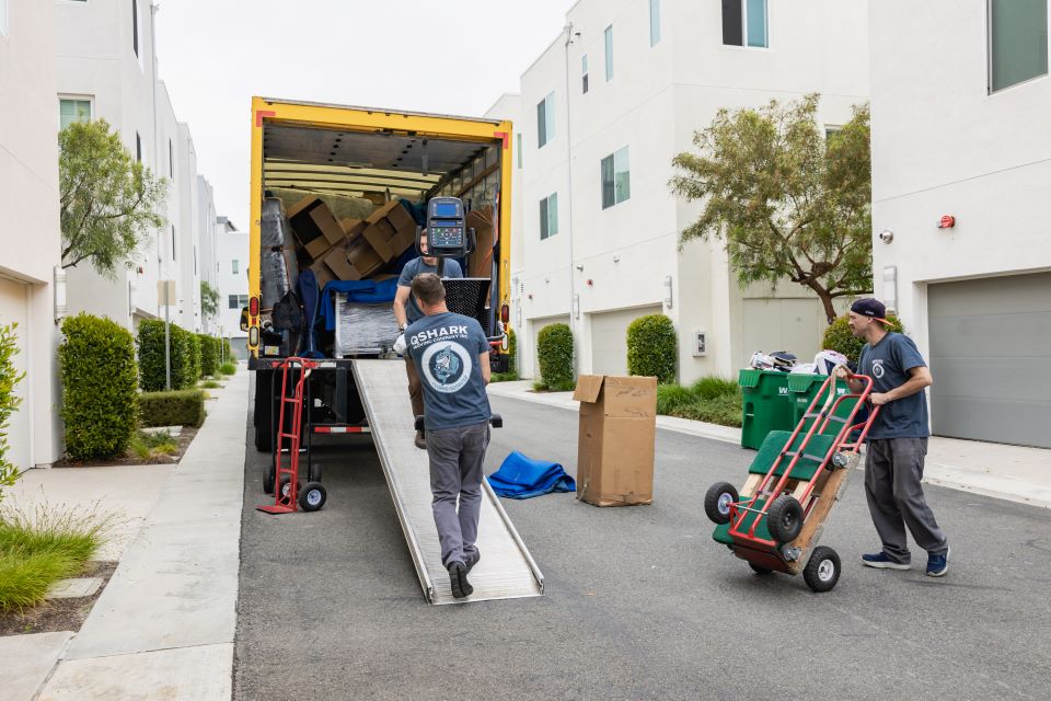 a picture of qshark movers loading a moving truck