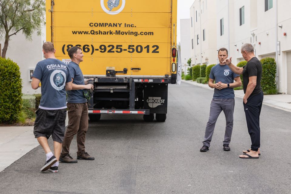 a picture of qshark movers and a customer moving from los angeles to san franciso