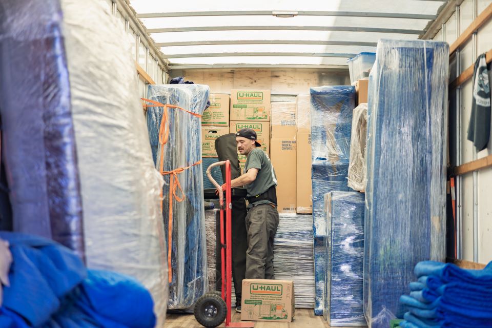 a picture of qshark movers inside a moving truck West Hollywood