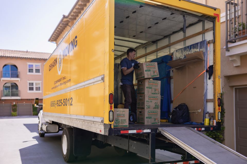 a picture of qshark mover unloading boxes in mira mesa