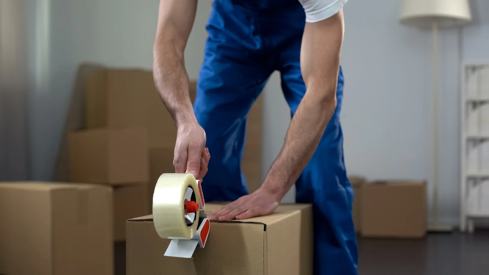 a picture of a person packing a fragile item