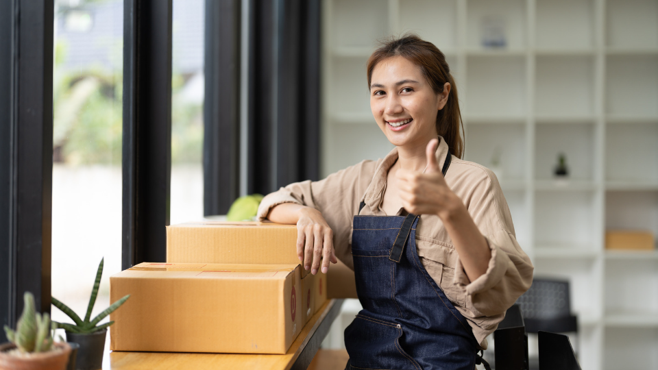 a person packing a box