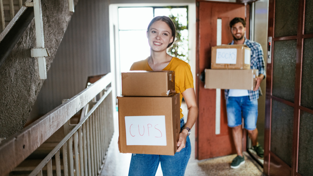 a happe couple moving with qshark moving company