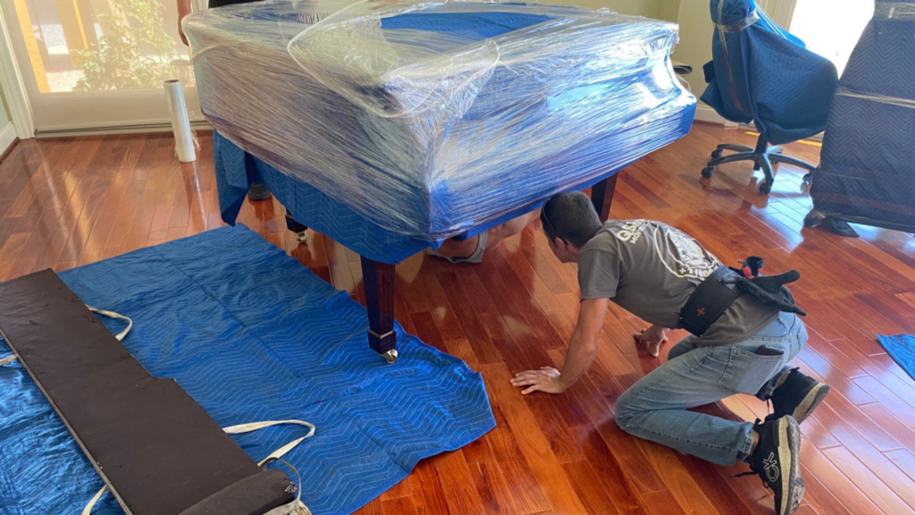 qshark weekend movers moving a piano