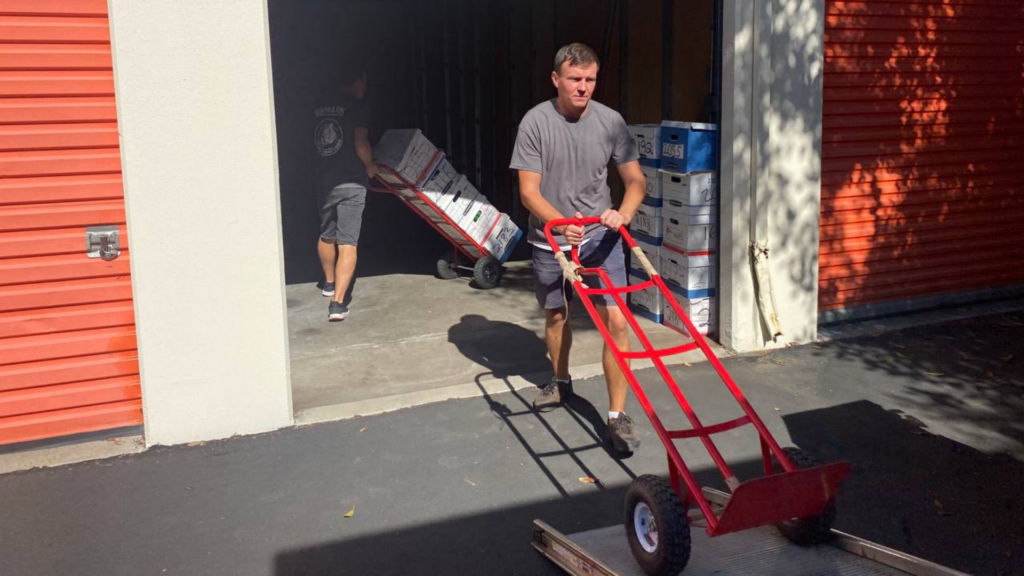 qshark movers unloading a storage on a weekend move