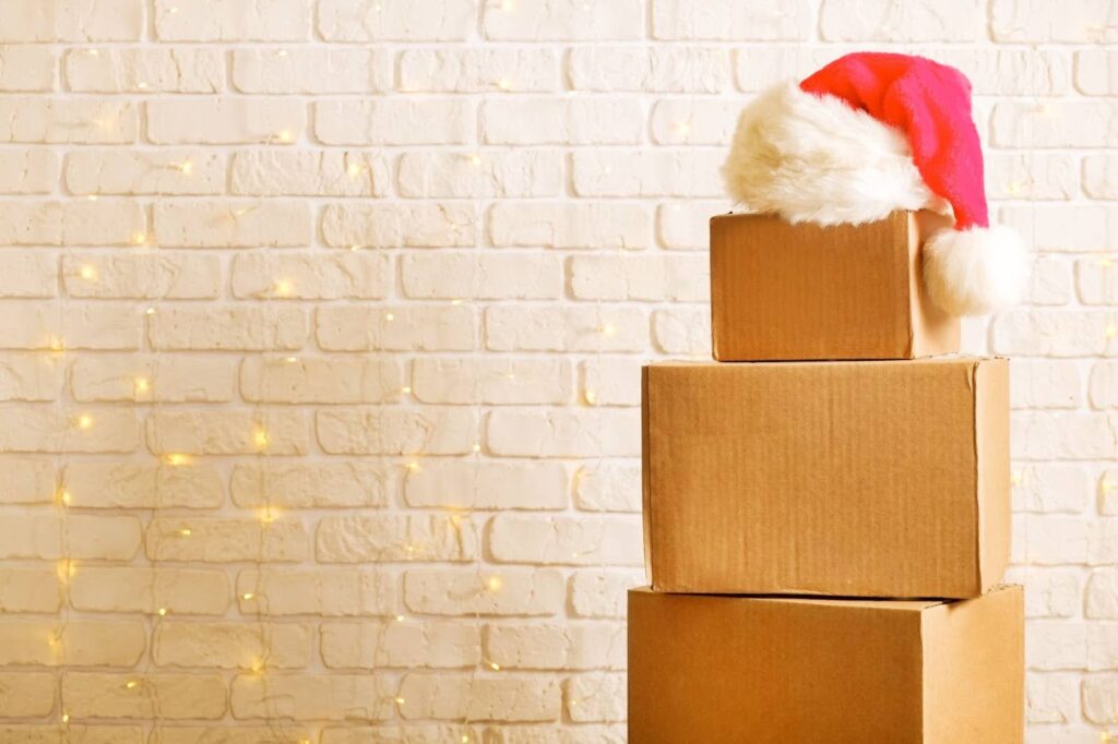 moving boxes with santa hat on top