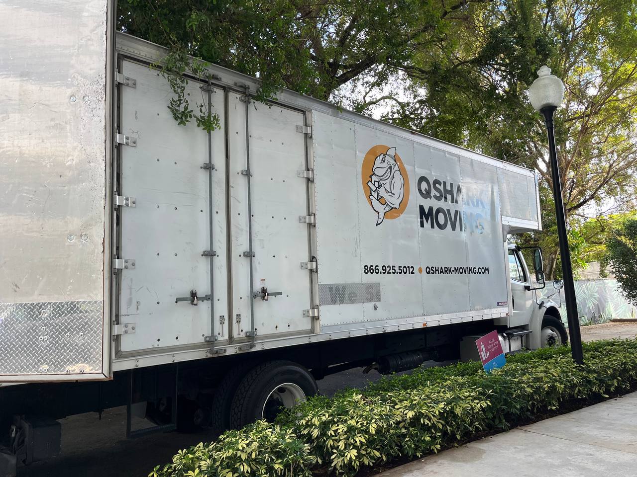 Qshark Moving Company truck ready for residential move and packing services